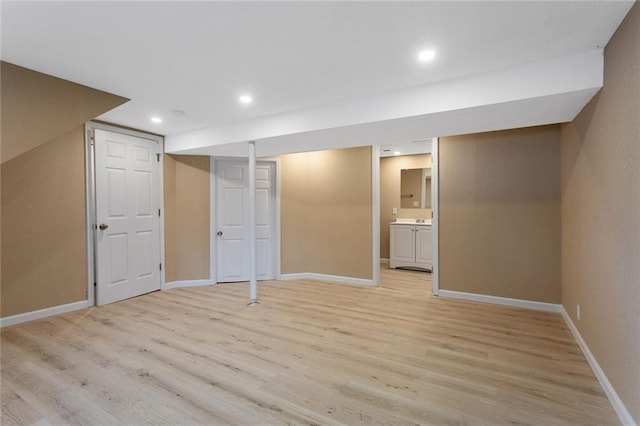113 SW 21st St, Oak Grove, MO 64075 - finished basement with light wood finished floors and recessed lighting
