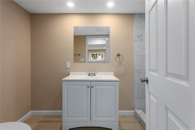113 SW 21st St, Oak Grove, MO 64075 - bathroom featuring vanity, wood finished floors, and a textured wall