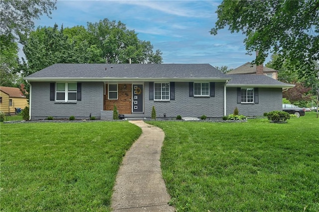 7824 Terrace St, Kansas City, MO 64114 - ranch-style house featuring a front yard, brick siding, roof with shingles, and a chimney