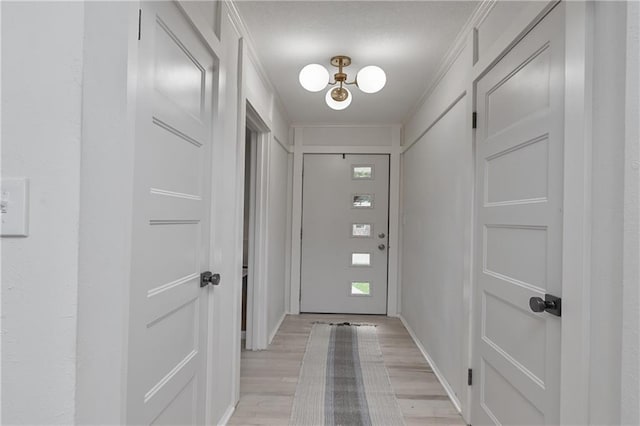 7824 Terrace St, Kansas City, MO 64114 - doorway to outside with light wood-type flooring and a chandelier