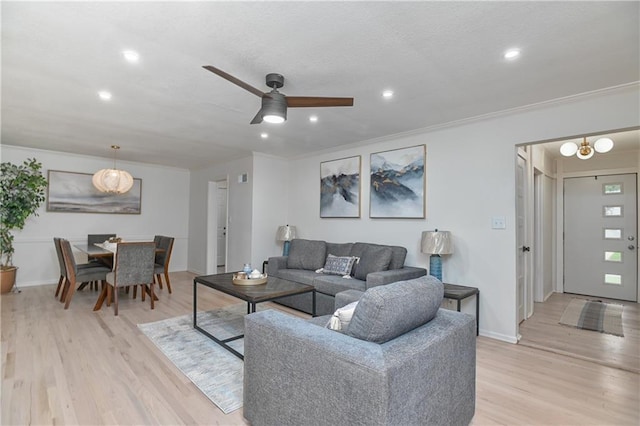 7824 Terrace St, Kansas City, MO 64114 - living area featuring a ceiling fan, light wood-style floors, ornamental molding, recessed lighting, and a textured ceiling