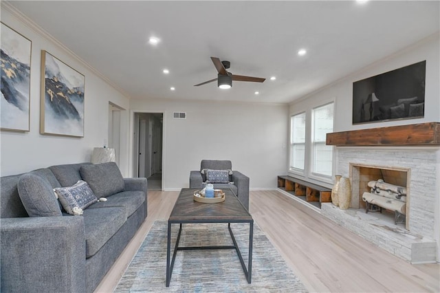7824 Terrace St, Kansas City, MO 64114 - living area featuring ornamental molding, a ceiling fan, recessed lighting, light wood-style floors, and a stone fireplace