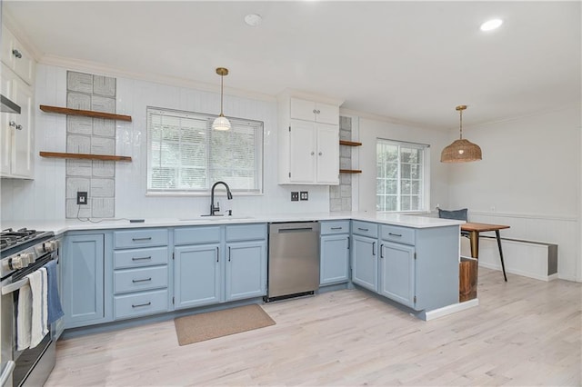 7824 Terrace St, Kansas City, MO 64114 - kitchen featuring appliances with stainless steel finishes, open shelves, a peninsula, blue cabinets, and ornamental molding