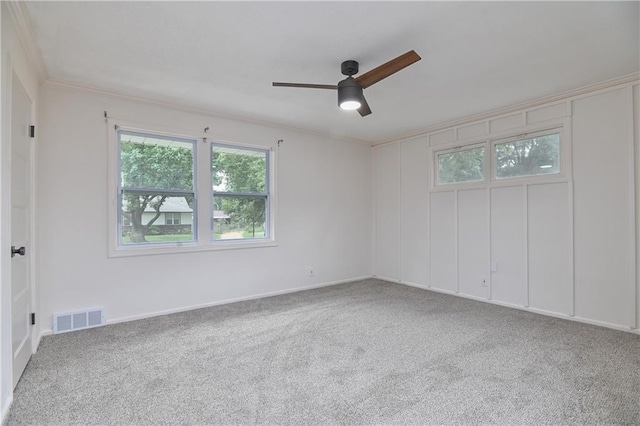7824 Terrace St, Kansas City, MO 64114 - spare room featuring healthy amount of natural light, a ceiling fan, carpet flooring, and crown molding