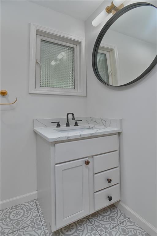 7824 Terrace St, Kansas City, MO 64114 - bathroom with tile patterned floors and vanity