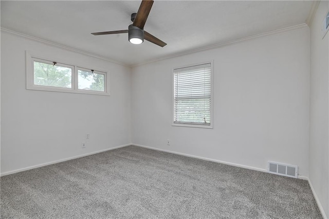 7824 Terrace St, Kansas City, MO 64114 - unfurnished room with crown molding, carpet floors, a ceiling fan, and plenty of natural light