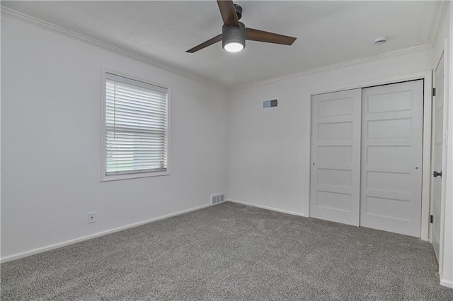 7824 Terrace St, Kansas City, MO 64114 - unfurnished bedroom with ornamental molding, carpet floors, a closet, and a ceiling fan