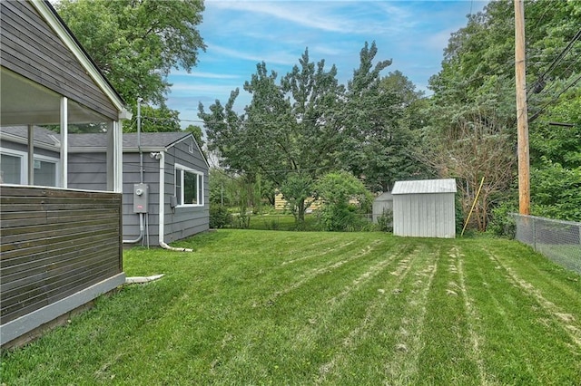 7824 Terrace St, Kansas City, MO 64114 - fenced backyard with a storage unit