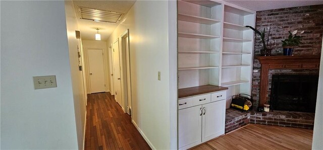 1113 W 27th St, Lawrence, KS 66046 - corridor with dark wood-style floors and baseboards