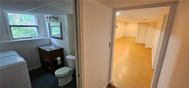 1113 W 27th St, Lawrence, KS 66046 - bathroom featuring vanity, recessed lighting, and washer and dryer