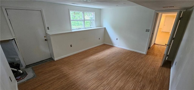 1113 W 27th St, Lawrence, KS 66046 - unfurnished bedroom with wood finished floors