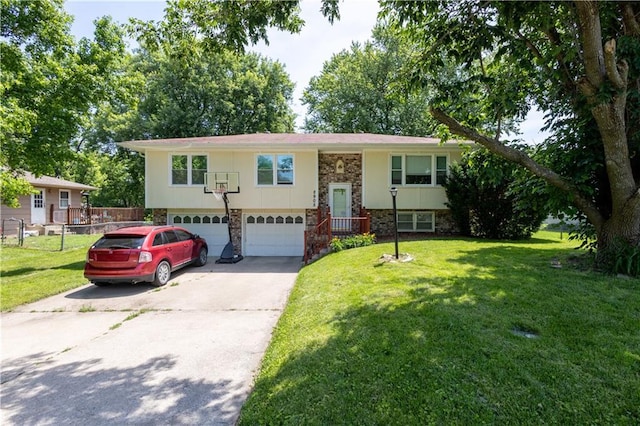 2905 Ajax Rd, Saint Joseph, MO 64503 - split foyer home with driveway, a garage, and stone siding