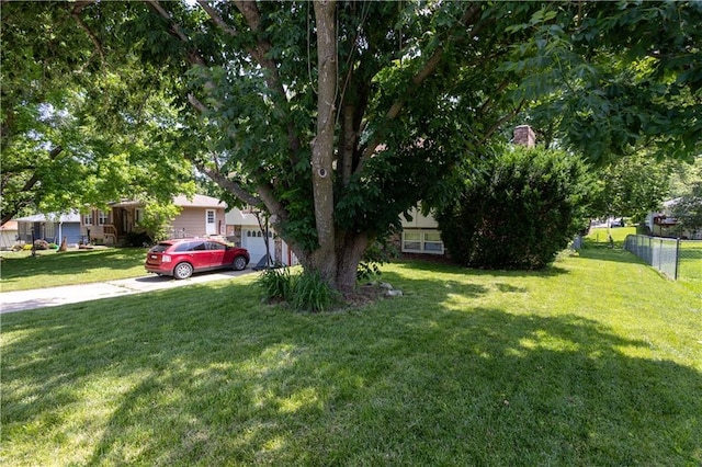 2905 Ajax Rd, Saint Joseph, MO 64503 - view of yard featuring concrete driveway and a garage