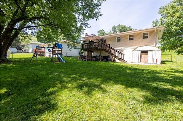 2905 Ajax Rd, Saint Joseph, MO 64503 - back of house with a playground, a fenced backyard, stairs, and a gazebo