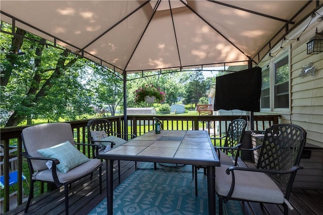 2905 Ajax Rd, Saint Joseph, MO 64503 - deck featuring outdoor dining area and a gazebo