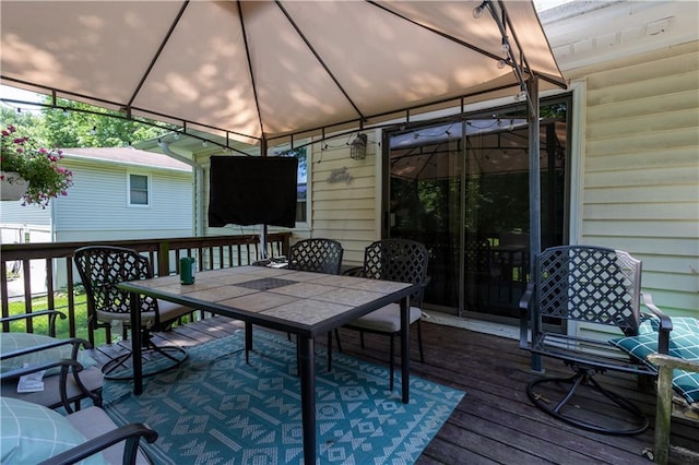 2905 Ajax Rd, Saint Joseph, MO 64503 - wooden deck featuring outdoor dining space and a gazebo