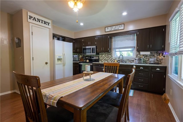 2905 Ajax Rd, Saint Joseph, MO 64503 - dining room featuring dark wood-style floors, plenty of natural light, ceiling fan, and recessed lighting