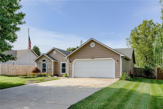 506 12th Ter, Tonganoxie, KS 66086 - ranch-style home featuring a garage and driveway
