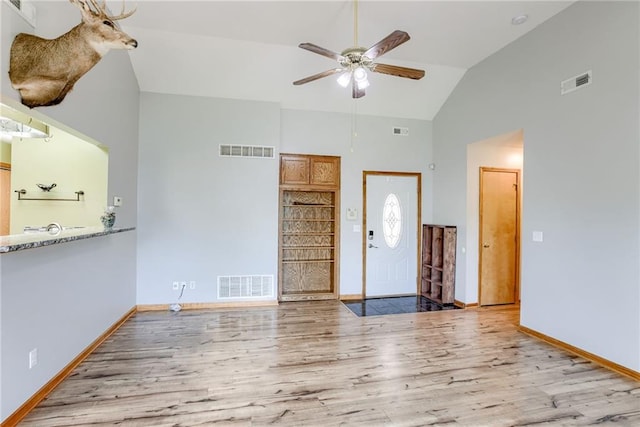 506 12th Ter, Tonganoxie, KS 66086 - foyer featuring a ceiling fan, wood finished floors, and high vaulted ceiling