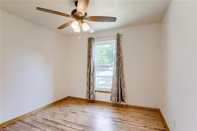 506 12th Ter, Tonganoxie, KS 66086 - unfurnished room featuring plenty of natural light, wood finished floors, and ceiling fan