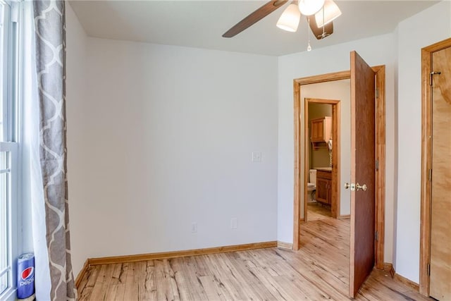 506 12th Ter, Tonganoxie, KS 66086 - spare room with ceiling fan and light wood finished floors