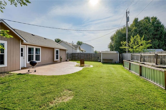 506 12th Ter, Tonganoxie, KS 66086 - fenced backyard featuring a patio area and a storage shed