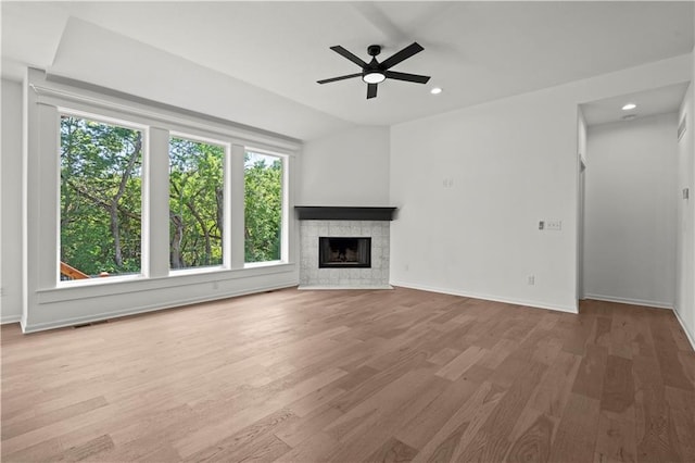 20015 W 221st St, Spring Hill, KS 66083 - unfurnished living room with a ceiling fan, wood finished floors, a fireplace, and recessed lighting