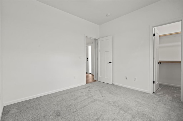 20015 W 221st St, Spring Hill, KS 66083 - unfurnished bedroom with carpet flooring, a walk in closet, and a closet