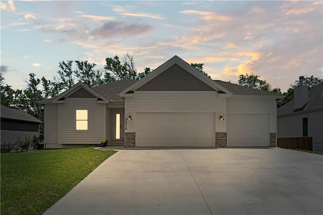 20015 W 221st St, Spring Hill, KS 66083 - view of front facade with an attached garage, driveway, a front yard, and stone siding