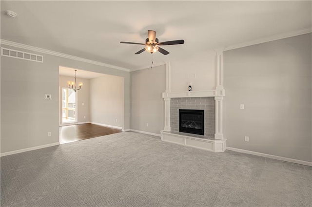 6110 NE 118th St, Kansas City, MO 64156 - unfurnished living room with a chandelier, ceiling fan, ornamental molding, carpet, and a fireplace