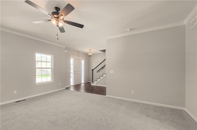 6110 NE 118th St, Kansas City, MO 64156 - spare room featuring crown molding, stairway, carpet flooring, and a ceiling fan