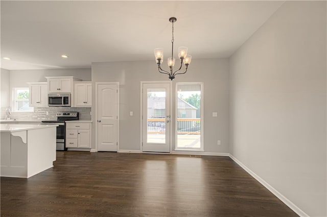 6110 NE 118th St, Kansas City, MO 64156 - kitchen with appliances with stainless steel finishes, dark wood-type flooring, white cabinets, and recessed lighting