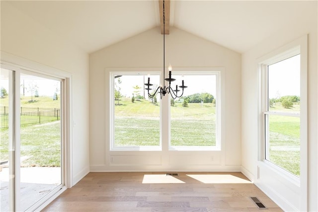 18505 Mohawk Ln, Overland Park, KS 66085 - unfurnished dining area with a chandelier, plenty of natural light, and light wood finished floors
