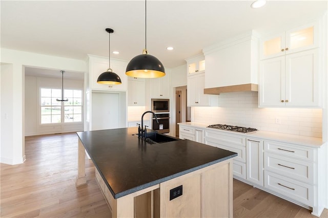 18505 Mohawk Ln, Overland Park, KS 66085 - kitchen featuring appliances with stainless steel finishes, light wood-type flooring, backsplash, dark countertops, and recessed lighting