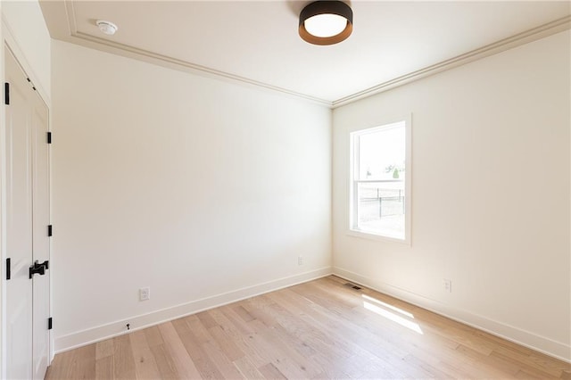 18505 Mohawk Ln, Overland Park, KS 66085 - empty room with light wood-type flooring, crown molding, and a smoke detector
