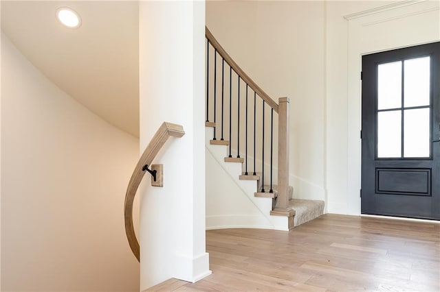18505 Mohawk Ln, Overland Park, KS 66085 - foyer entrance featuring wood finished floors, stairs, and recessed lighting