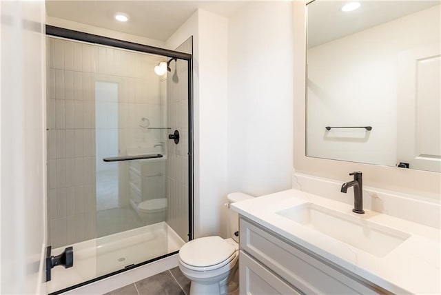 18505 Mohawk Ln, Overland Park, KS 66085 - bathroom featuring vanity, a stall shower, tile patterned flooring, and recessed lighting