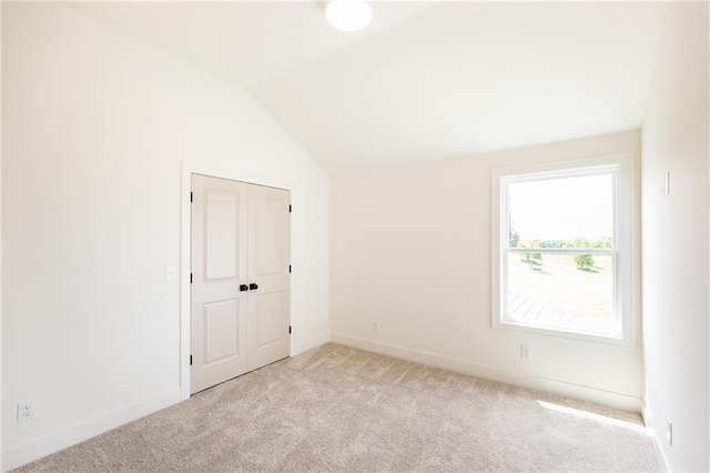 18505 Mohawk Ln, Overland Park, KS 66085 - unfurnished room with carpet flooring and lofted ceiling