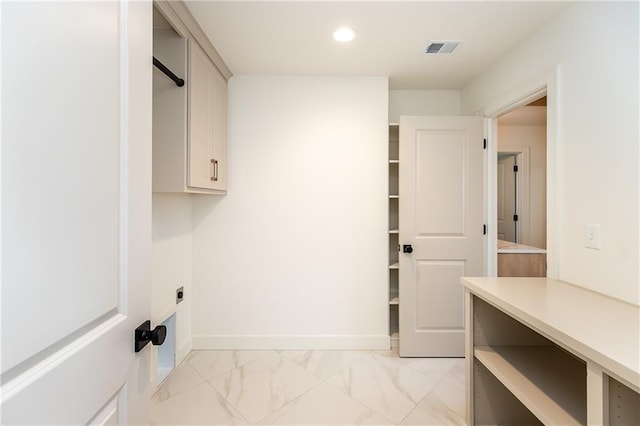 18505 Mohawk Ln, Overland Park, KS 66085 - laundry room with recessed lighting and light marble finish floors