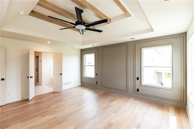 18505 Mohawk Ln, Overland Park, KS 66085 - unfurnished bedroom with a tray ceiling, light wood finished floors, and beamed ceiling