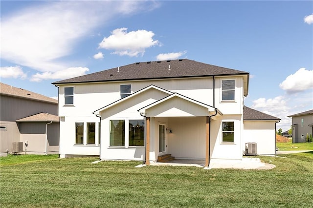 18505 Mohawk Ln, Overland Park, KS 66085 - back of property with a yard and a shingled roof