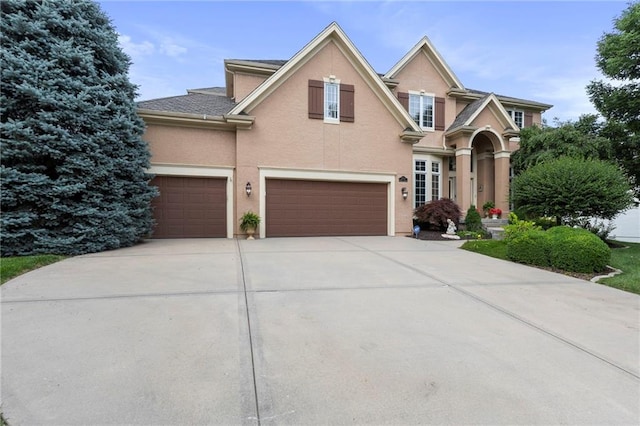 5716 W 146th St, Overland Park, KS 66223 - traditional home featuring concrete driveway, stucco siding, and a garage
