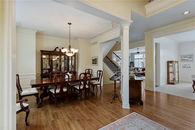 5716 W 146th St, Overland Park, KS 66223 - dining area featuring stairs, wood finished floors, ornamental molding, and a chandelier