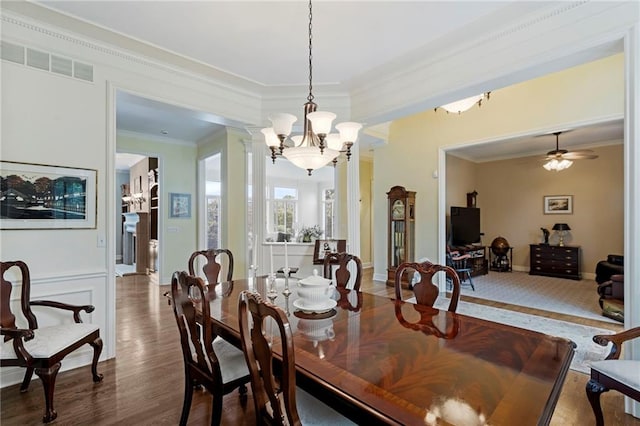5716 W 146th St, Overland Park, KS 66223 - dining room featuring a chandelier, ornamental molding, wood finished floors, and ceiling fan