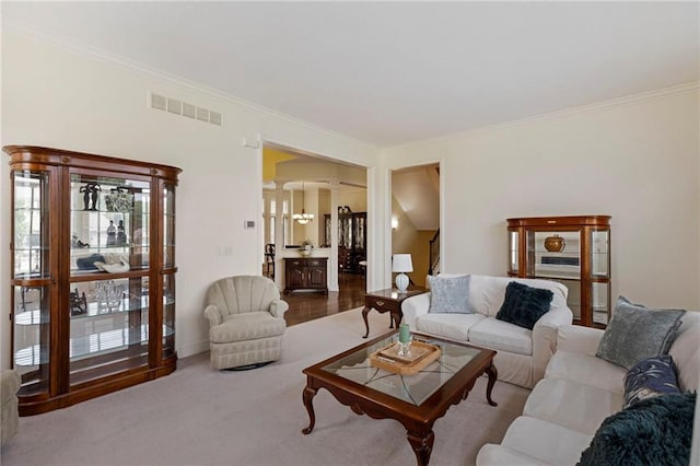 5716 W 146th St, Overland Park, KS 66223 - living room featuring decorative columns, ornamental molding, and carpet floors