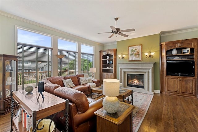 5716 W 146th St, Overland Park, KS 66223 - living area with a ceiling fan, ornamental molding, a glass covered fireplace, and wood finished floors