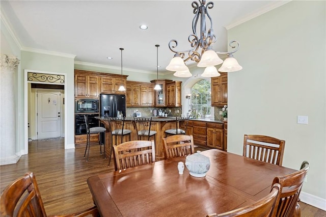 5716 W 146th St, Overland Park, KS 66223 - dining room featuring dark wood-type flooring, crown molding, a chandelier, and recessed lighting