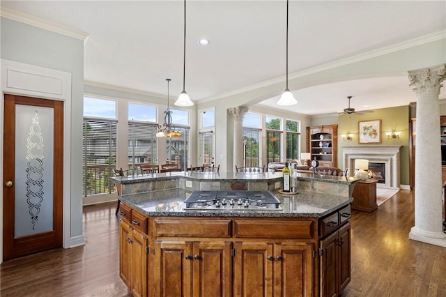 5716 W 146th St, Overland Park, KS 66223 - kitchen featuring decorative columns, stainless steel gas cooktop, ceiling fan, and ornamental molding
