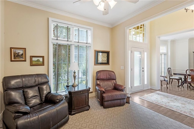 5716 W 146th St, Overland Park, KS 66223 - living area with crown molding, a ceiling fan, and light wood-type flooring