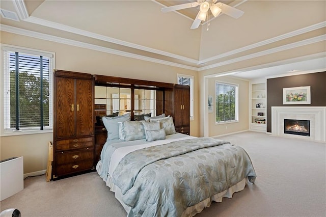 5716 W 146th St, Overland Park, KS 66223 - carpeted bedroom with multiple windows, crown molding, a tray ceiling, and a glass covered fireplace